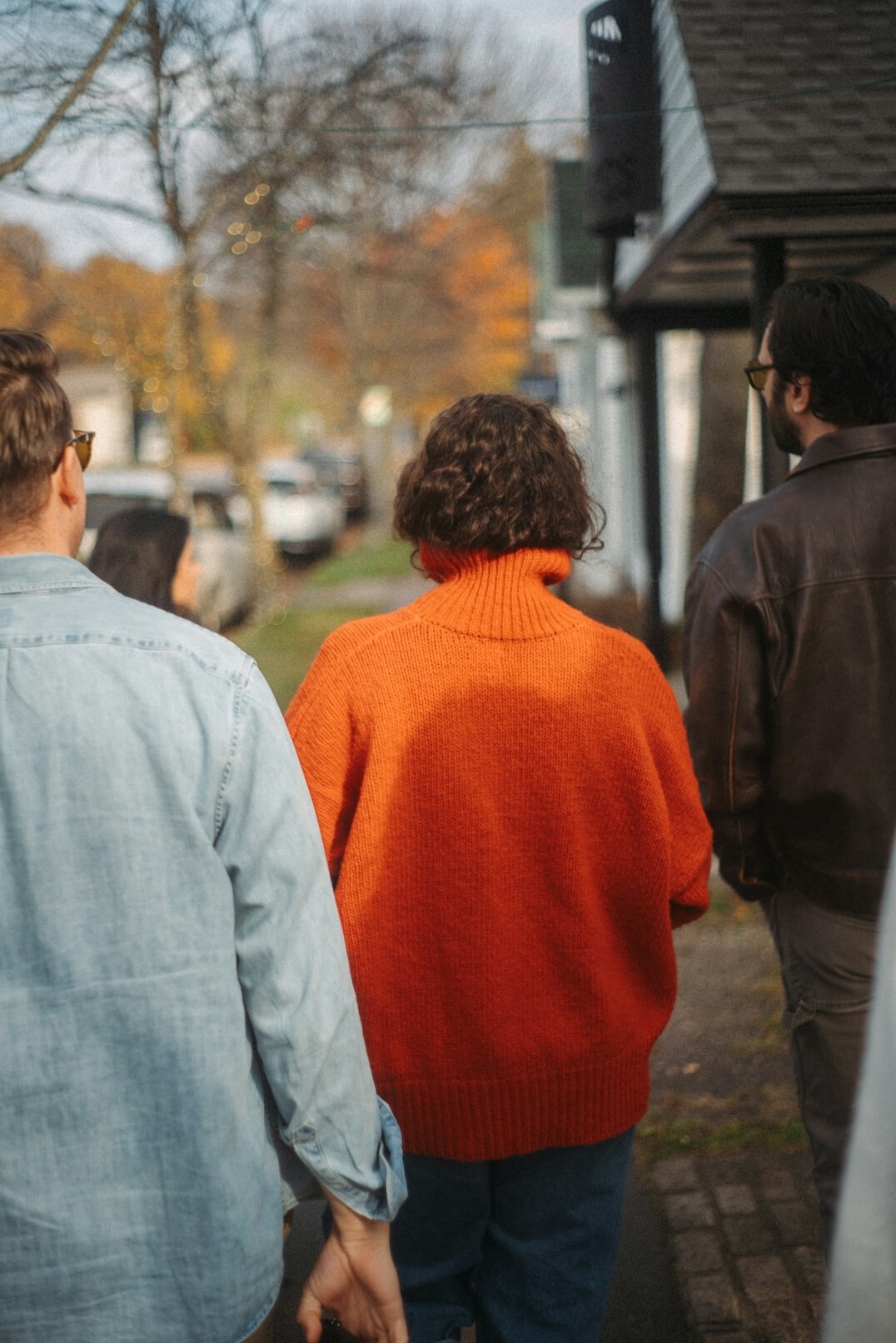 group of locals chatting on sidewalk