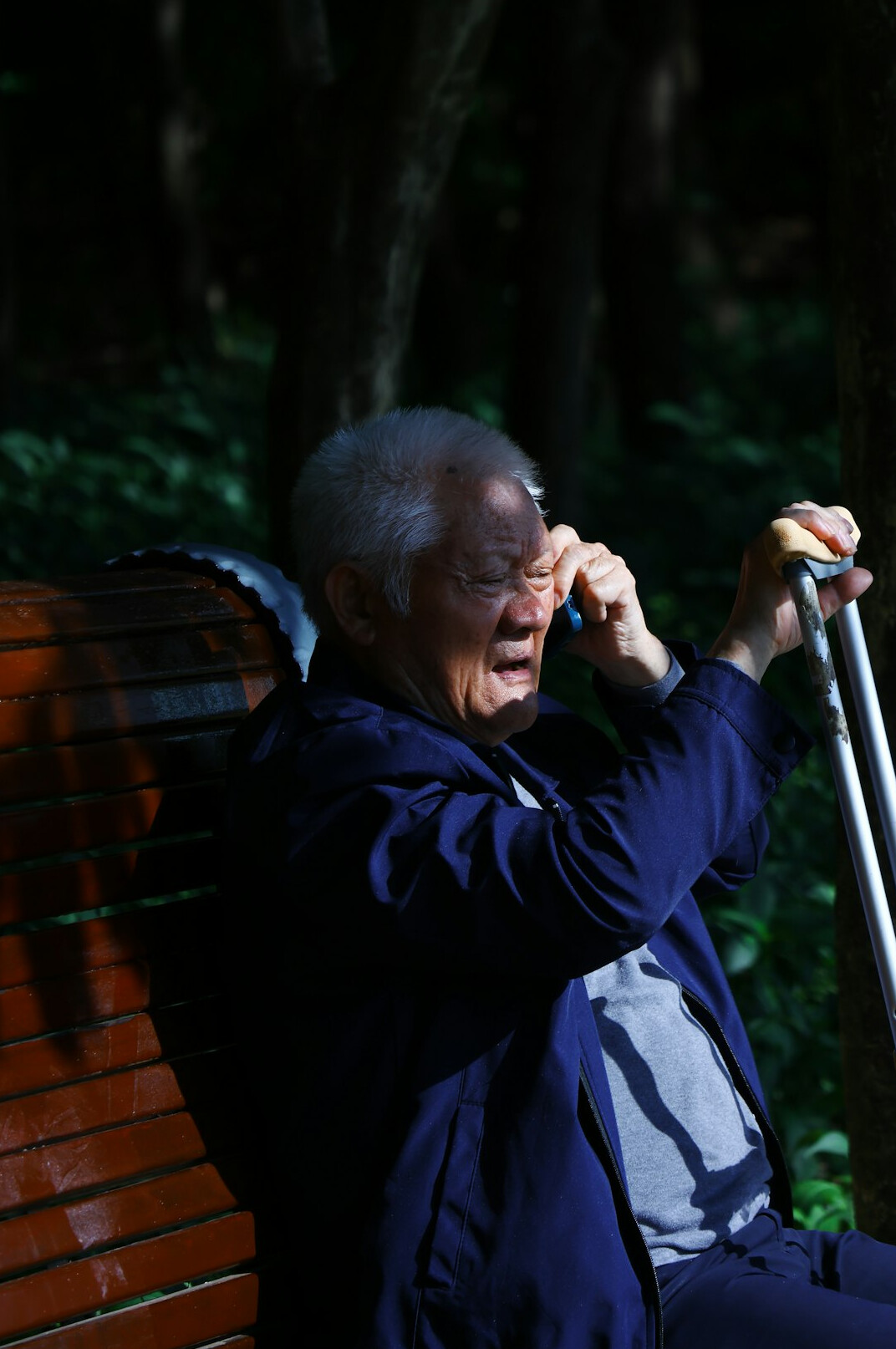 elderly man telling story on bench